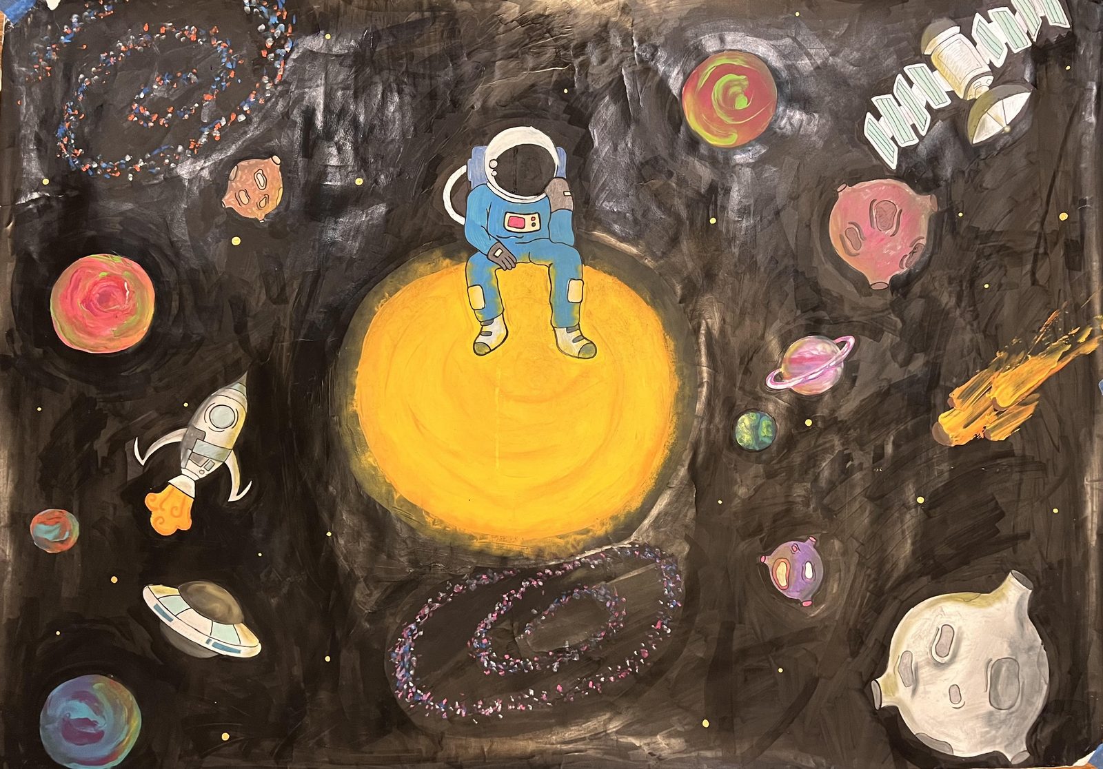 An astronaut sitting on a glowing yellow planet in deep space, surrounded by moons, rockets and galaxies